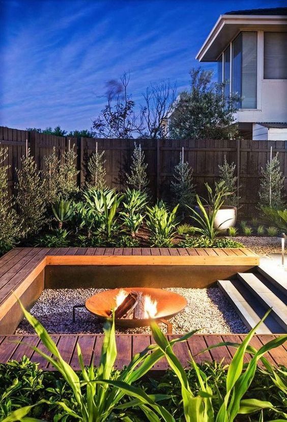 Finished landscaped backyard with turf and outdoor lighting